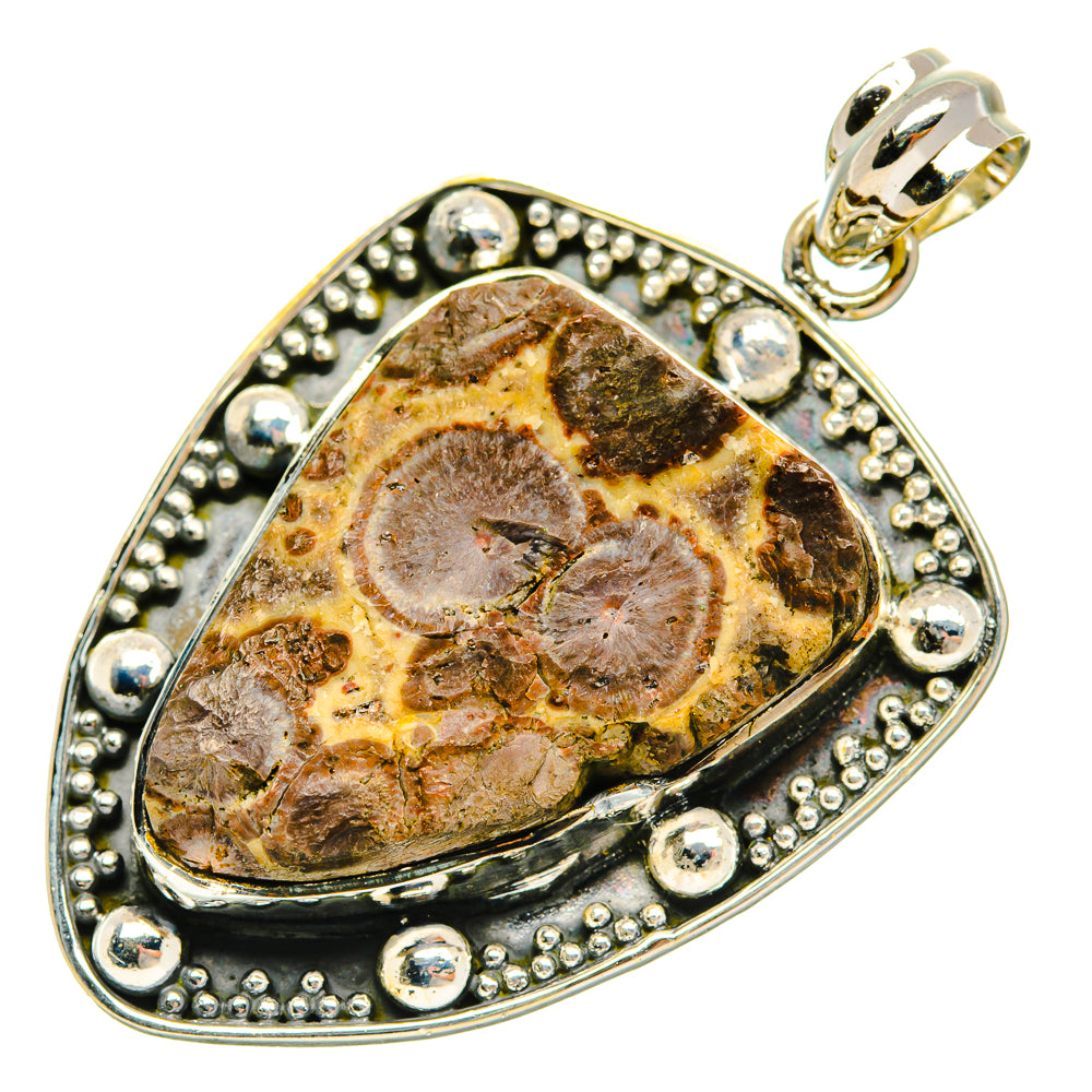 Sterling silver oval pendant with brown rhyolite stone, beaded bezel, top bail