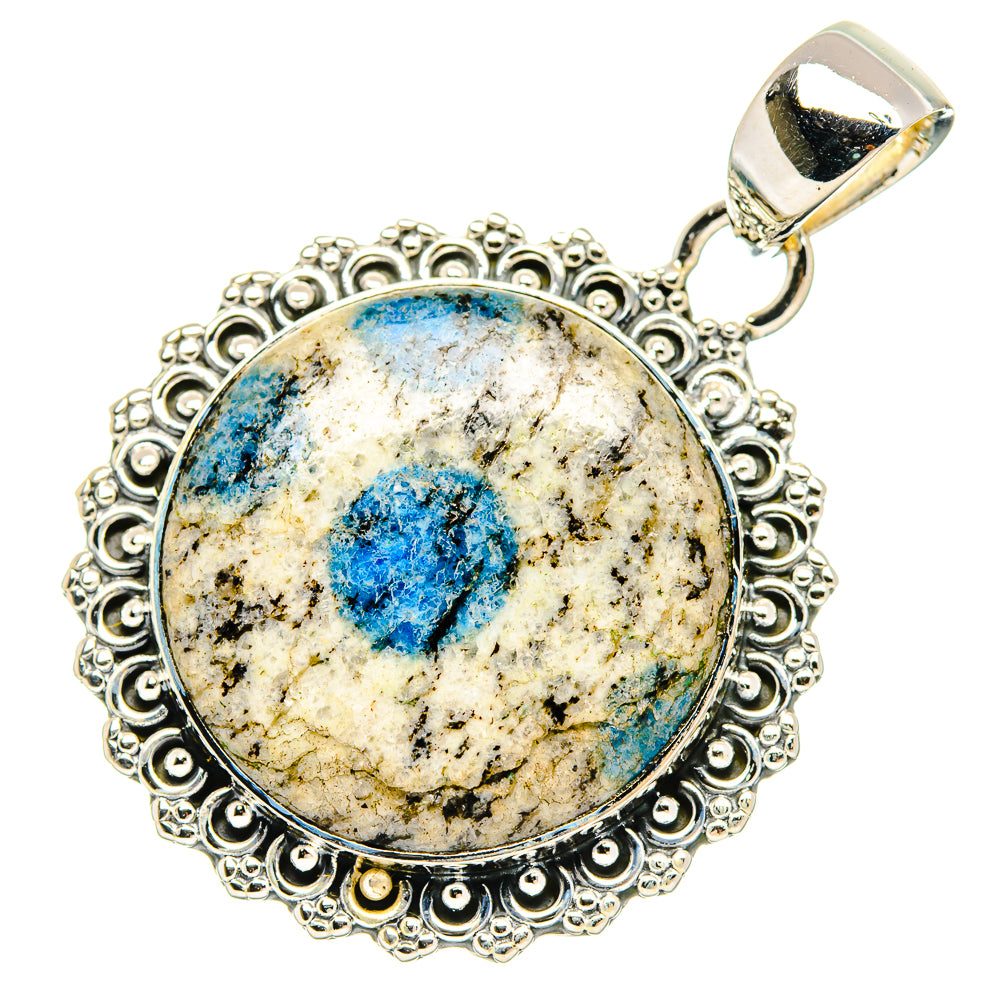 Oval sterling silver pendant with blue azurite cabochon and top bail, ornate bezel