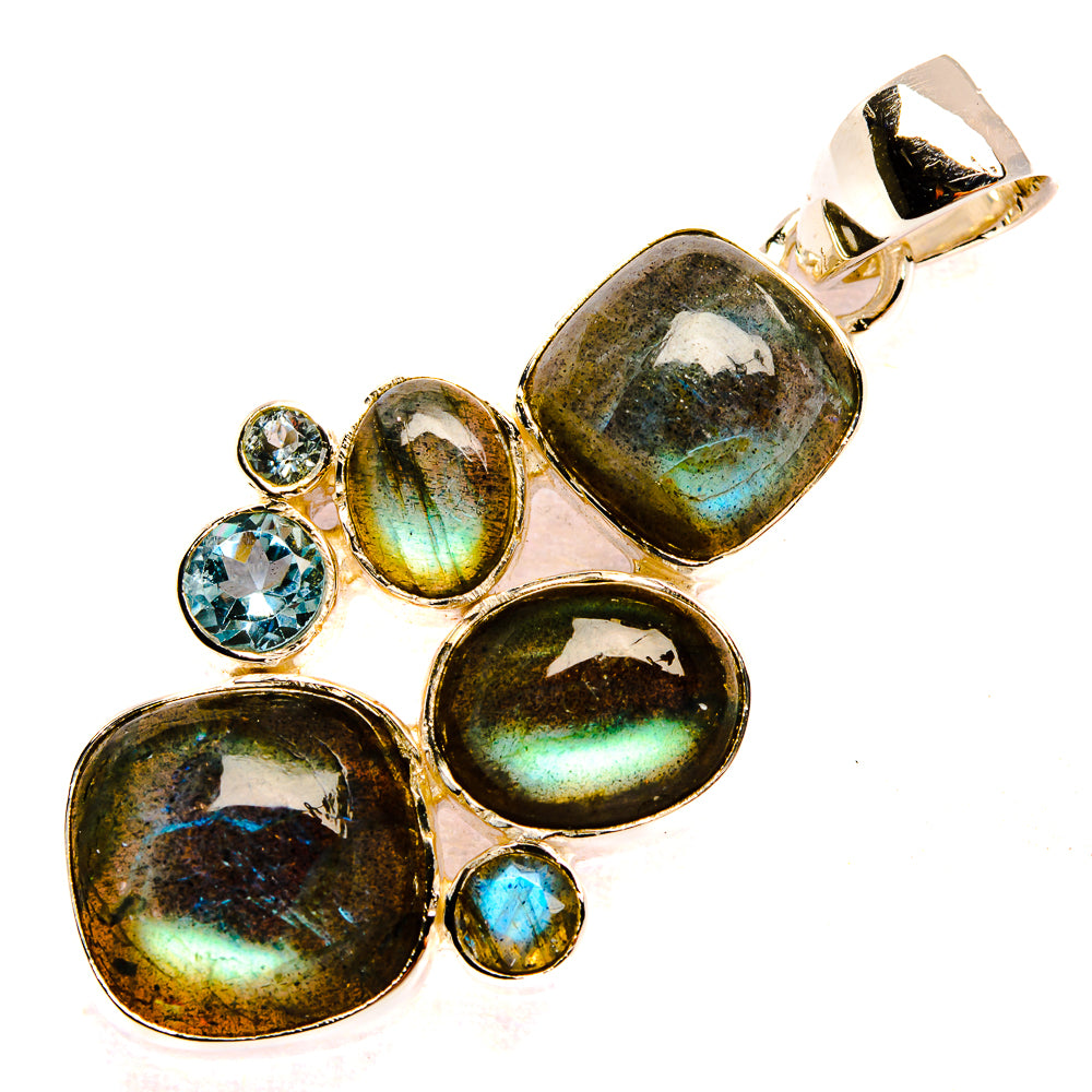 Sterling silver pendant with labradorite ovals and blue topaz accents