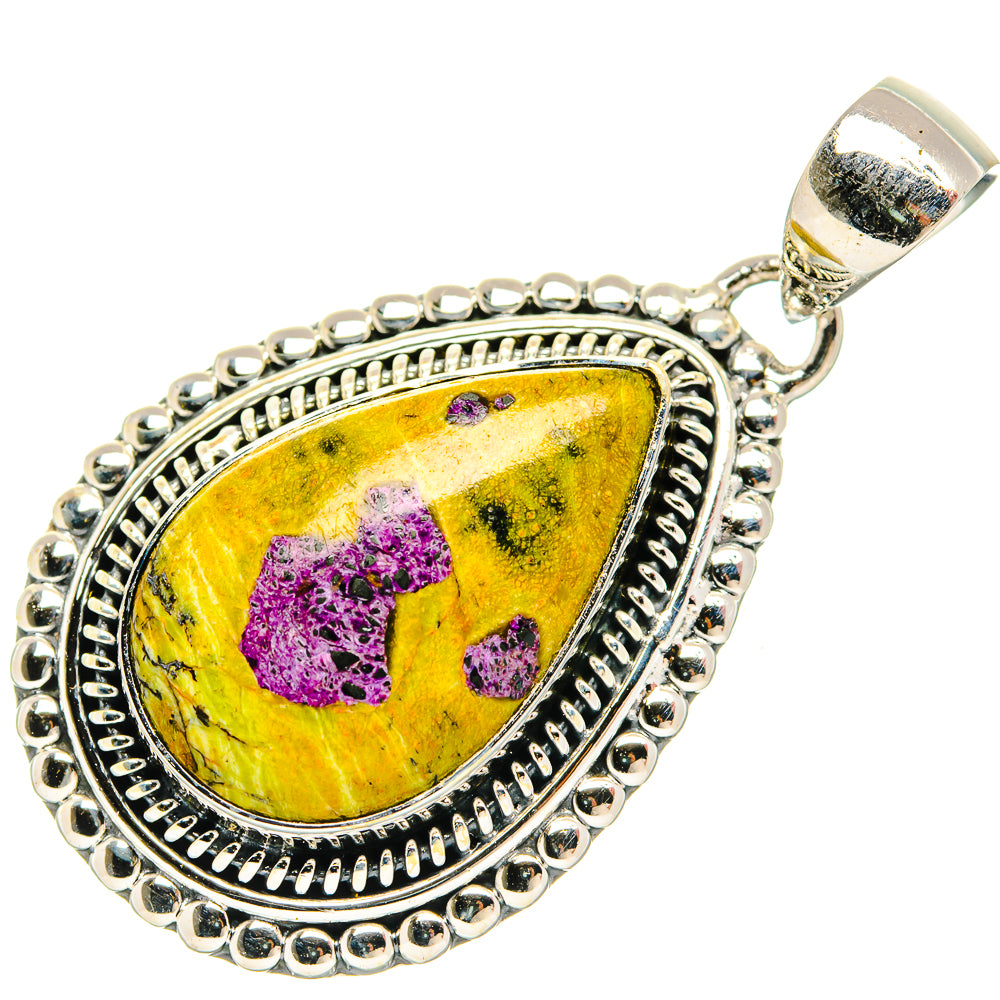 Pear-shaped sterling silver pendant with yellow-purple stone and bail, beaded frame.