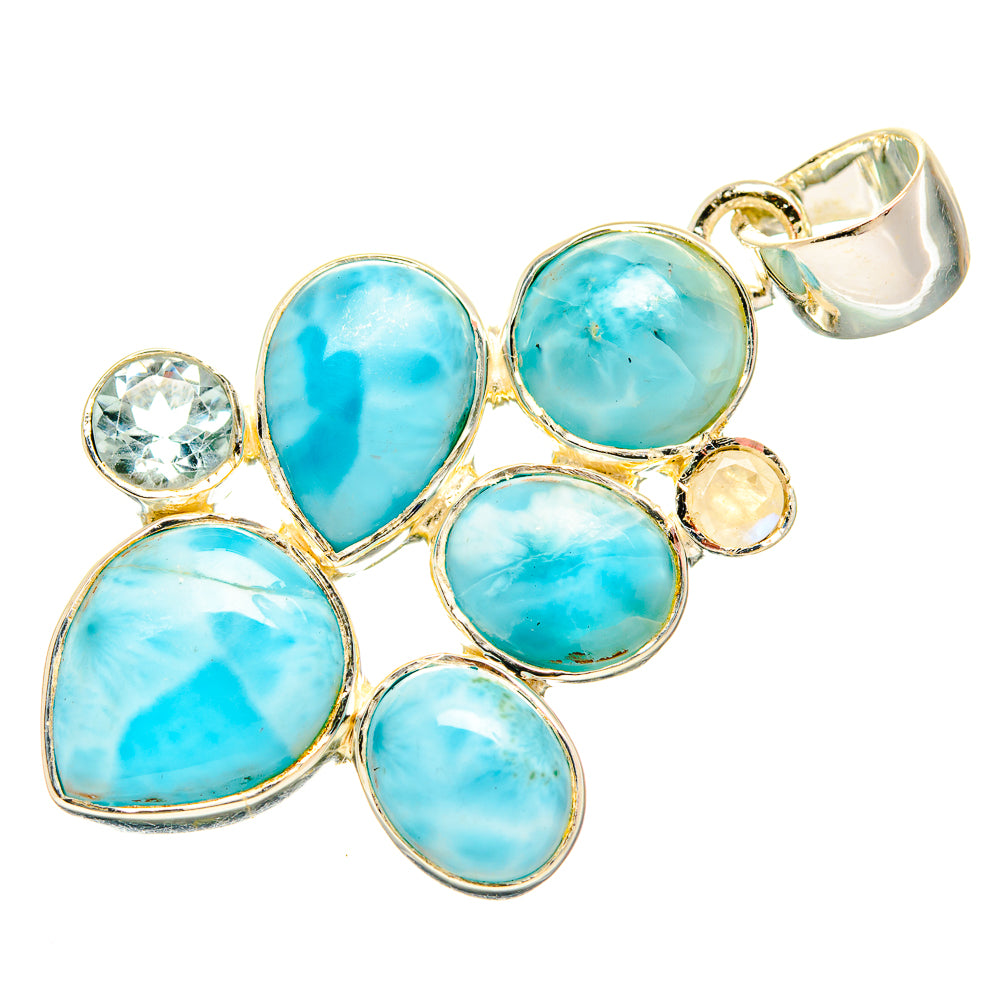 Gemstone pendant featuring blue oval and teardrop stones with small round sides, top bail