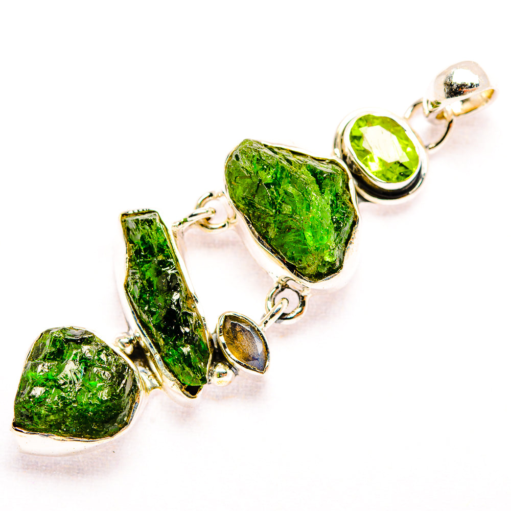 Silver-tone peridot pendant with rough green gemstones and teardrop settings