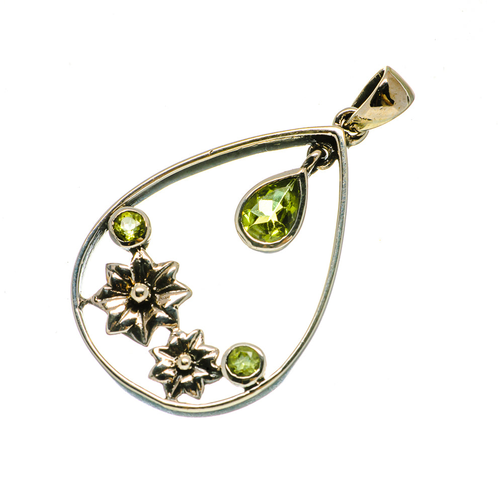 Sterling silver teardrop pendant with peridot-green stones, stars, and bail loop
