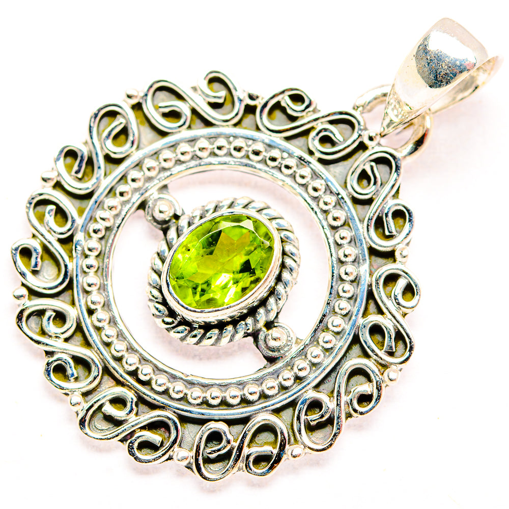 925 sterling silver peridot pendant with lime-green oval gemstone and swirled filigree border