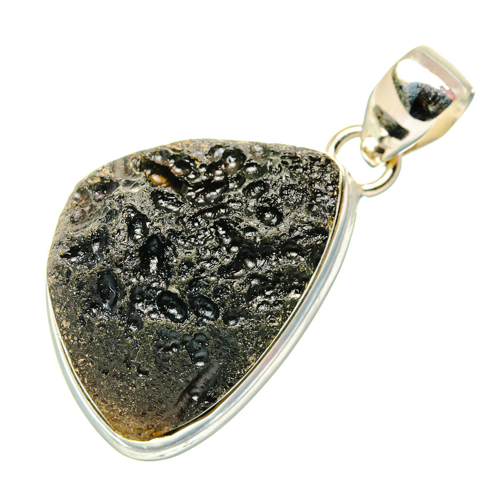 Tektite pendant with textured black stone teardrop frame and bail, sterling silver