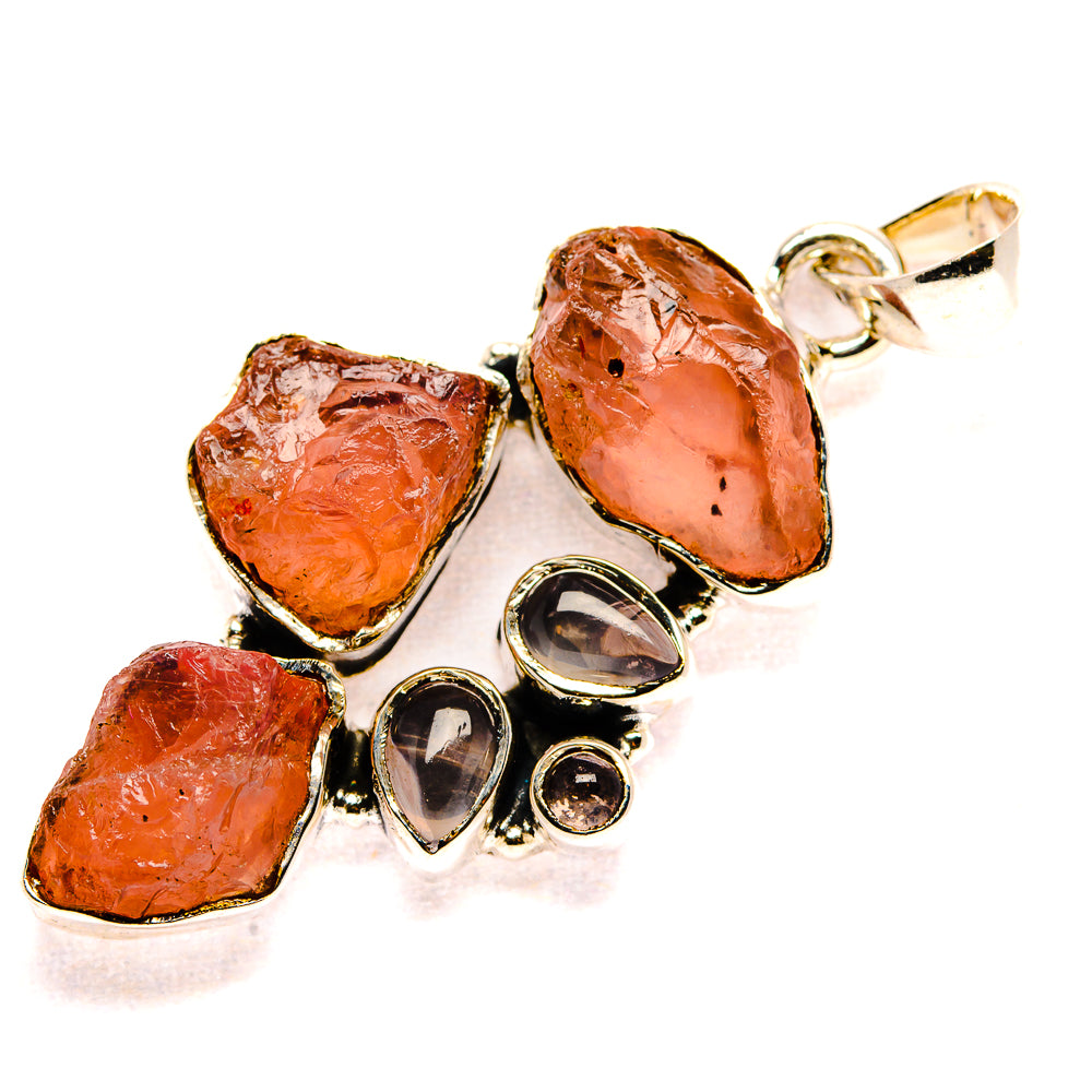 Rough rose quartz pendant with orange-pink stones in 925 sterling silver setting