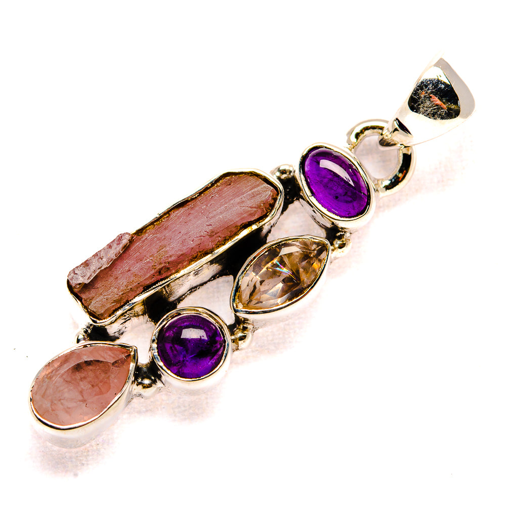 Sterling silver pendant with rough rose quartz and amethyst cabochons in bezel and prongs