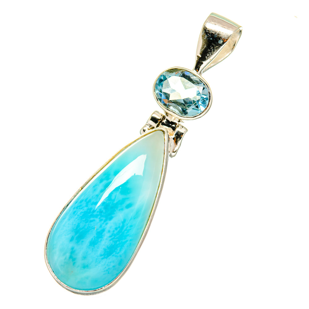 Sterling silver pendant with round blue topaz and teardrop larimar stone