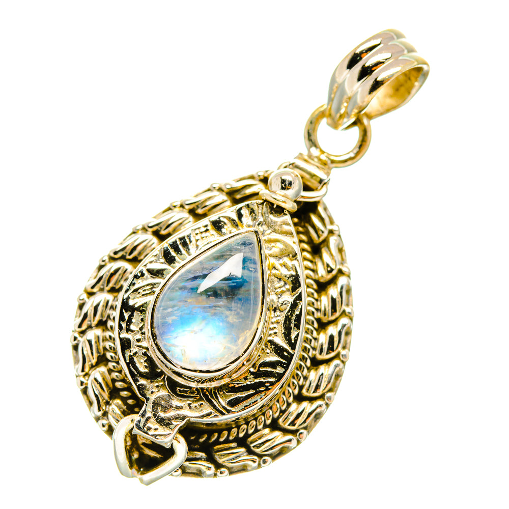 Ornate teardrop moonstone pendant with gold-tone filigree and hinged loop bail