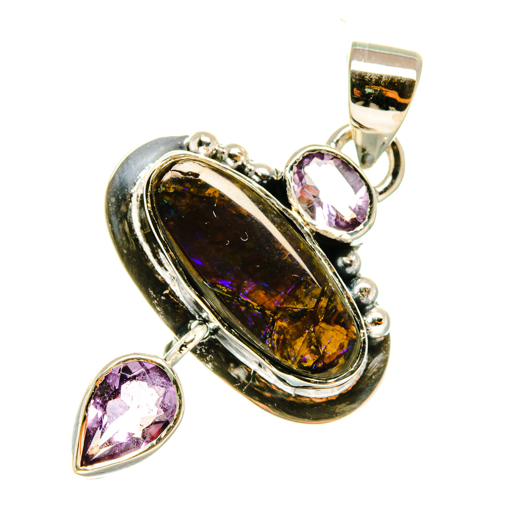 Ammolite and amethyst pendant, oval ammolite set in silver with pink teardrop stones and bail