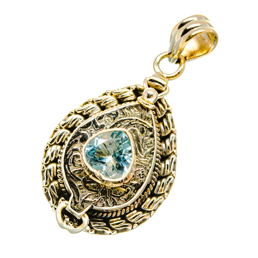 Sterling silver pendant with round bezel blue topaz gemstone and decorative frame