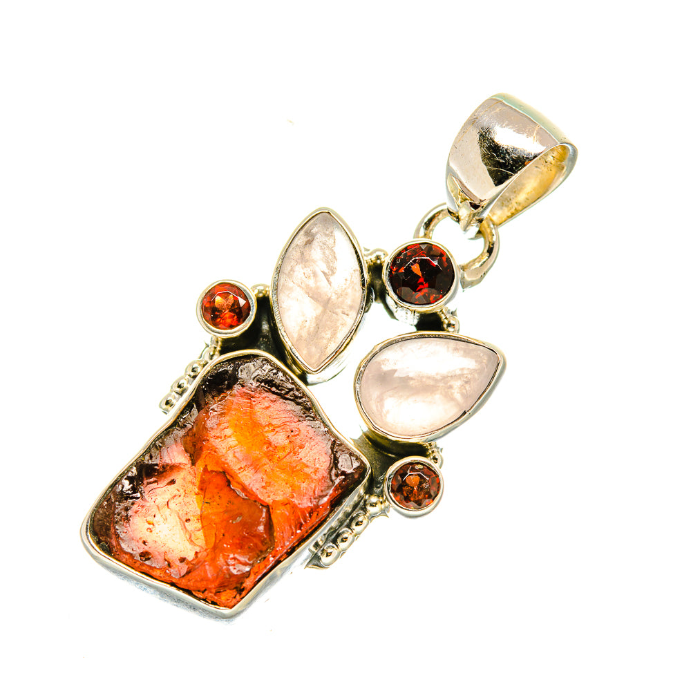 Sterling silver pendant with orange rough stone, pink moonstone, and red round accents