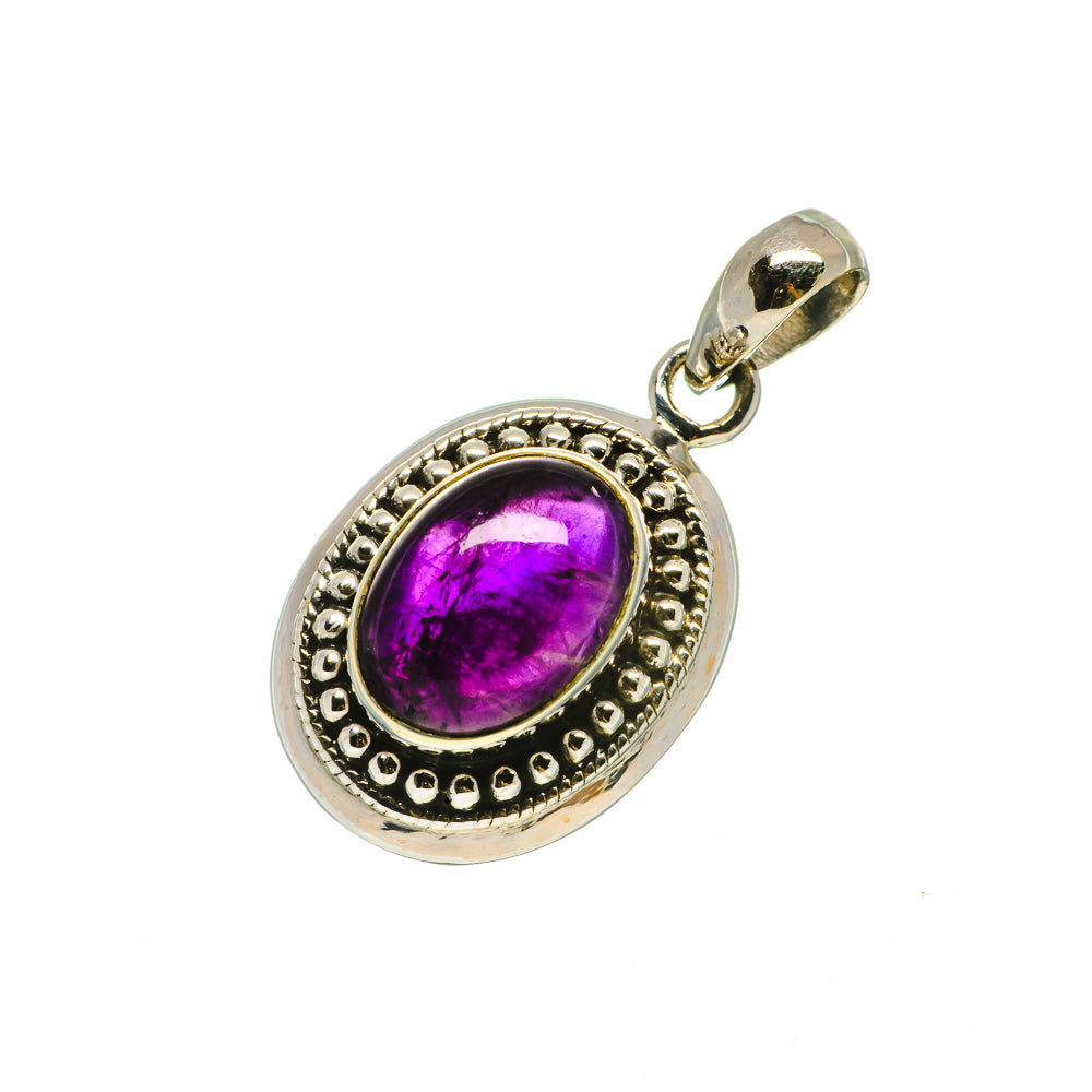 Sterling silver oval pendant with bezel-set purple amethyst cabochon and scalloped border