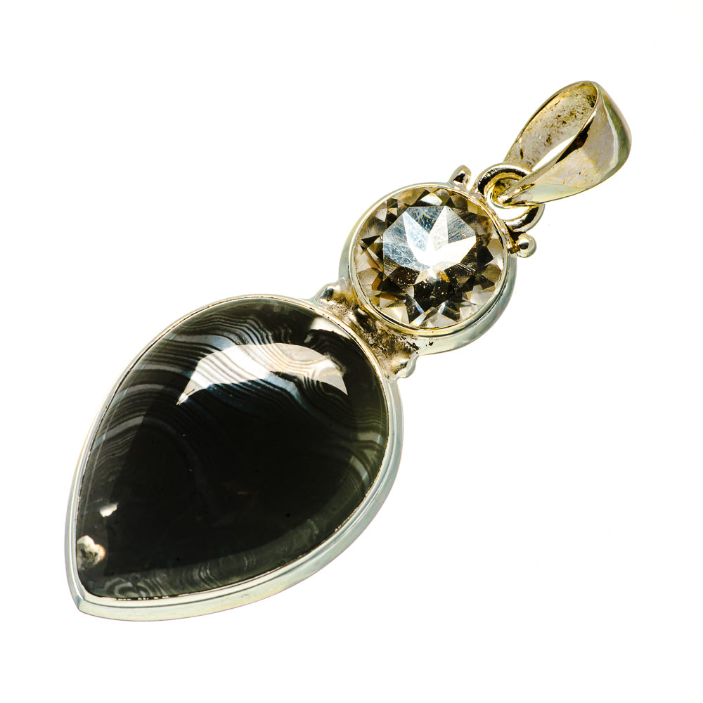 Sterling silver teardrop pendant with dark oval gemstone and light round faceted stone
