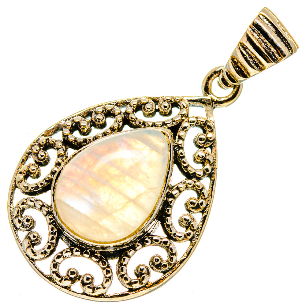 Teardrop moonstone pendant with filigree border and bail, gold-tone setting
