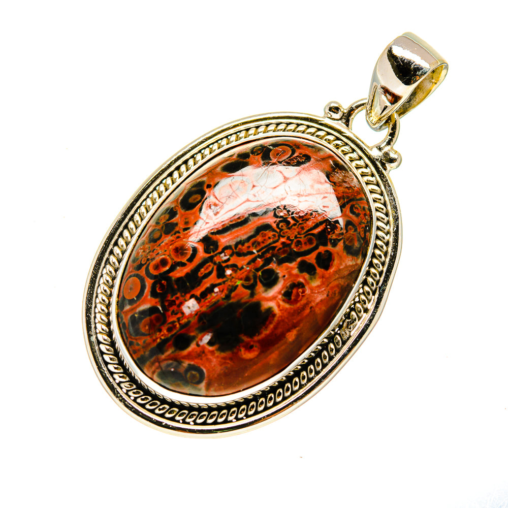 Oval ocean jasper pendant with decorative silver-tone frame and loop bail