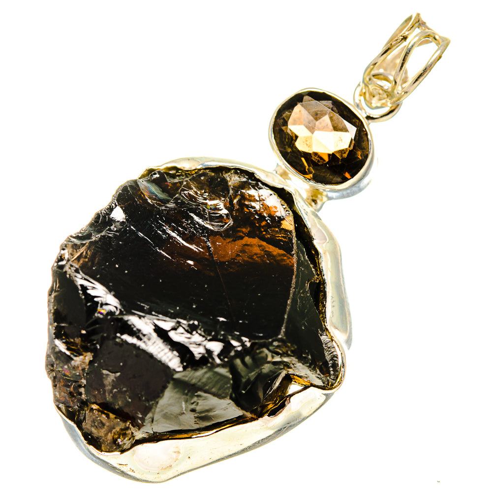 Rough smoky quartz pendant with silver-tone bezel and loop bail, black stone centerpiece