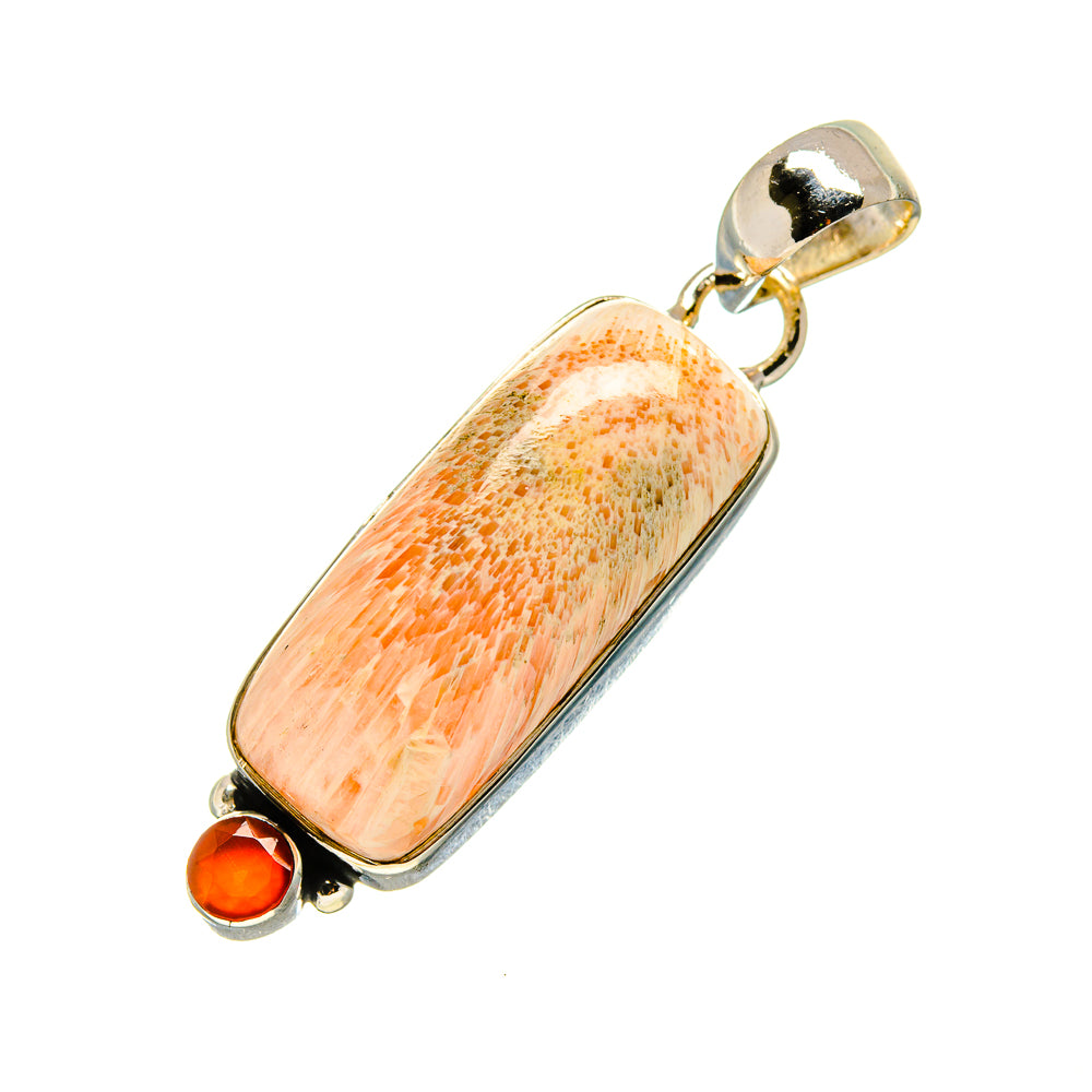 Elongated peach-orange pendant with small round carnelian accent and top metal loop