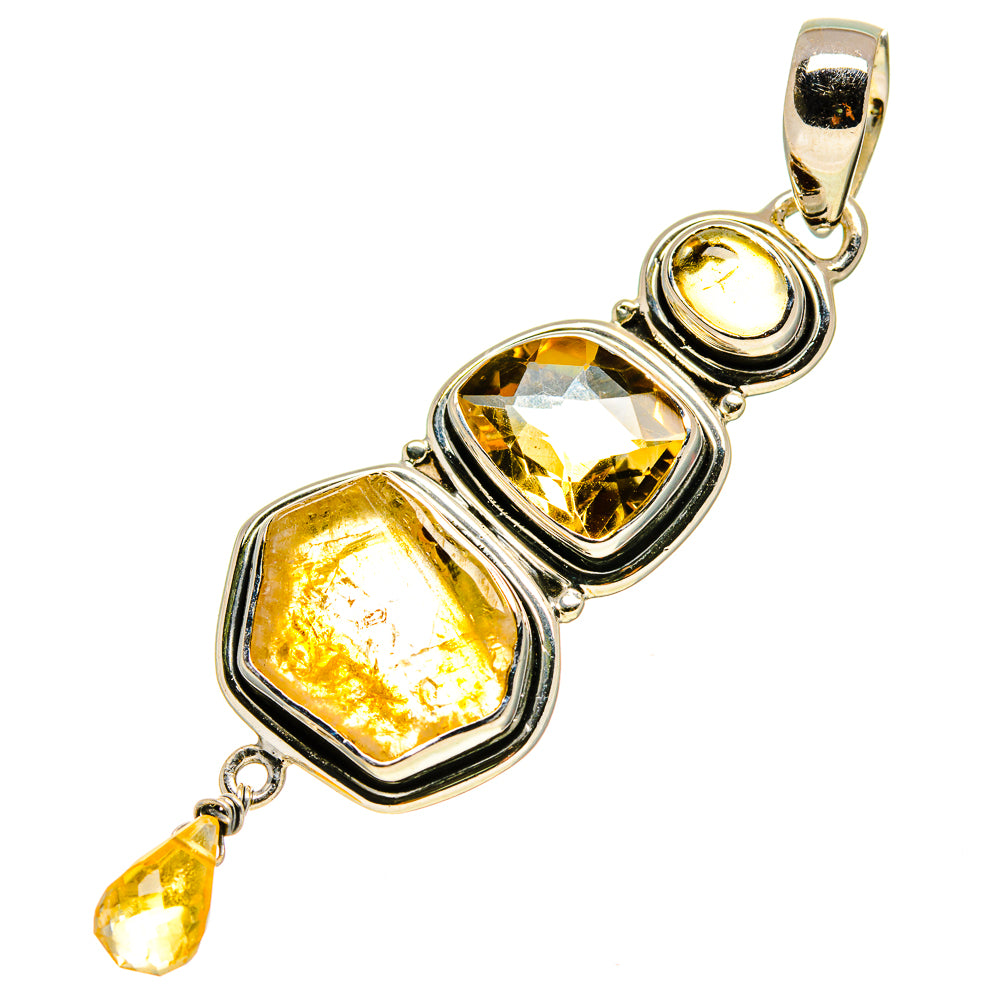 Sterling silver citrine pendant with rectangular faceted stone and rough citrine drop