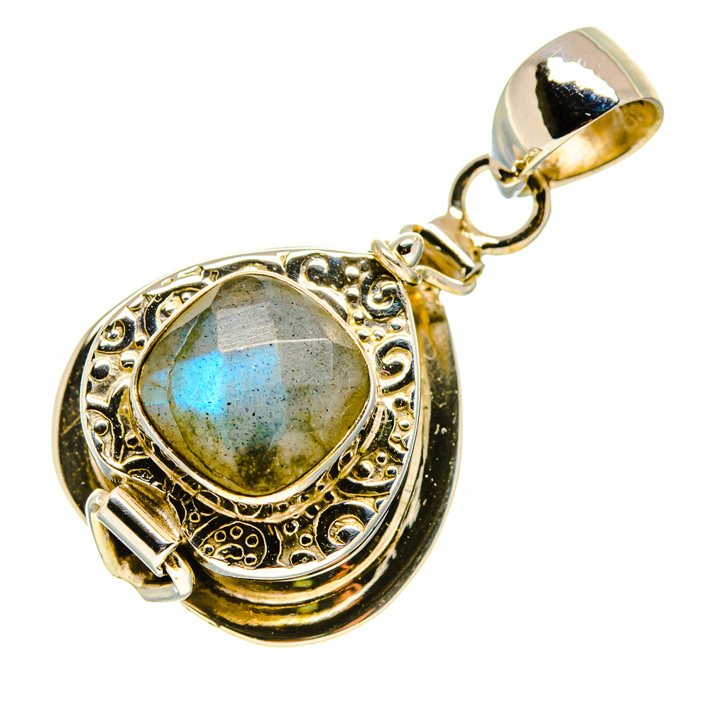 Oval labradorite gemstone pendant with decorative bezel and silver bail loop