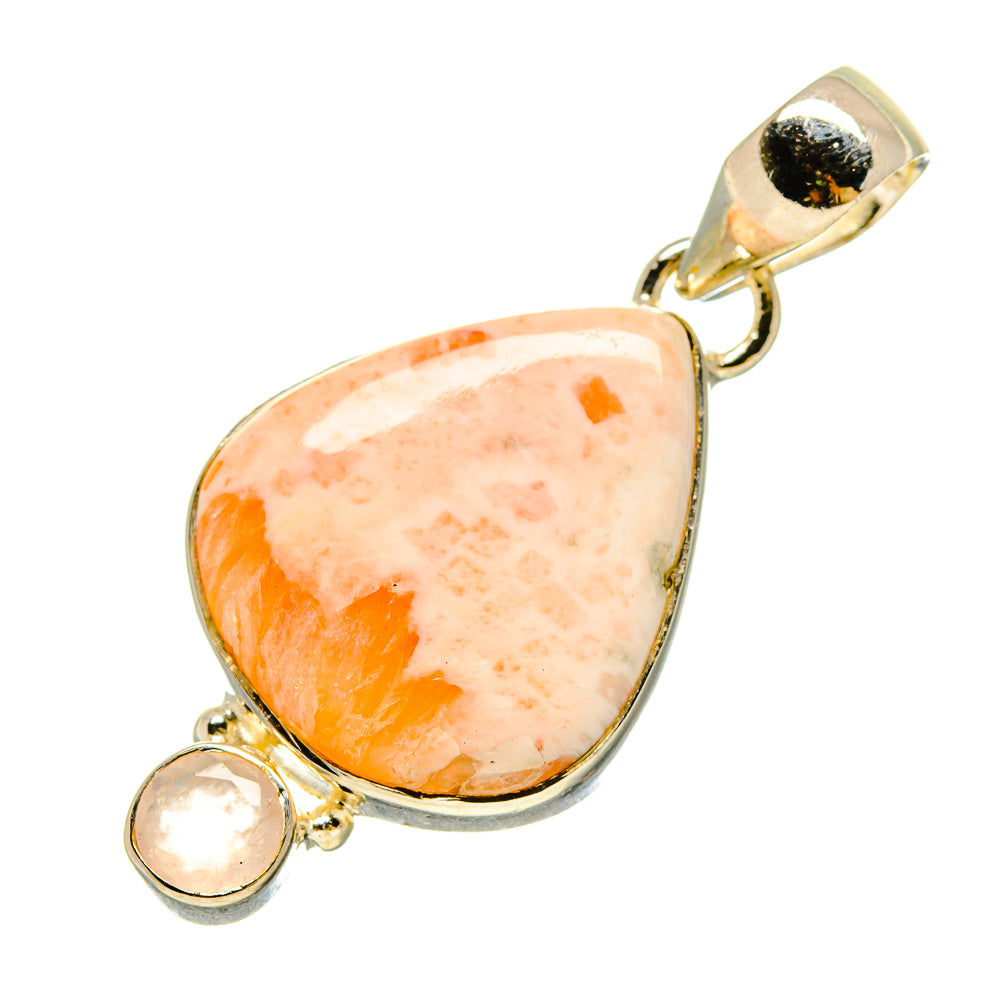 Rose quartz pendant with teardrop cabochon, silver bezel, and two small round stones