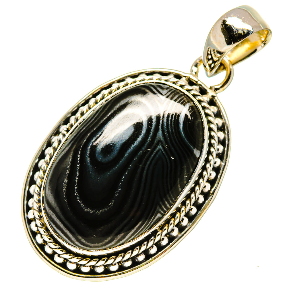 Oval black psilomelane pendant in ornate silver frame with top loop bail