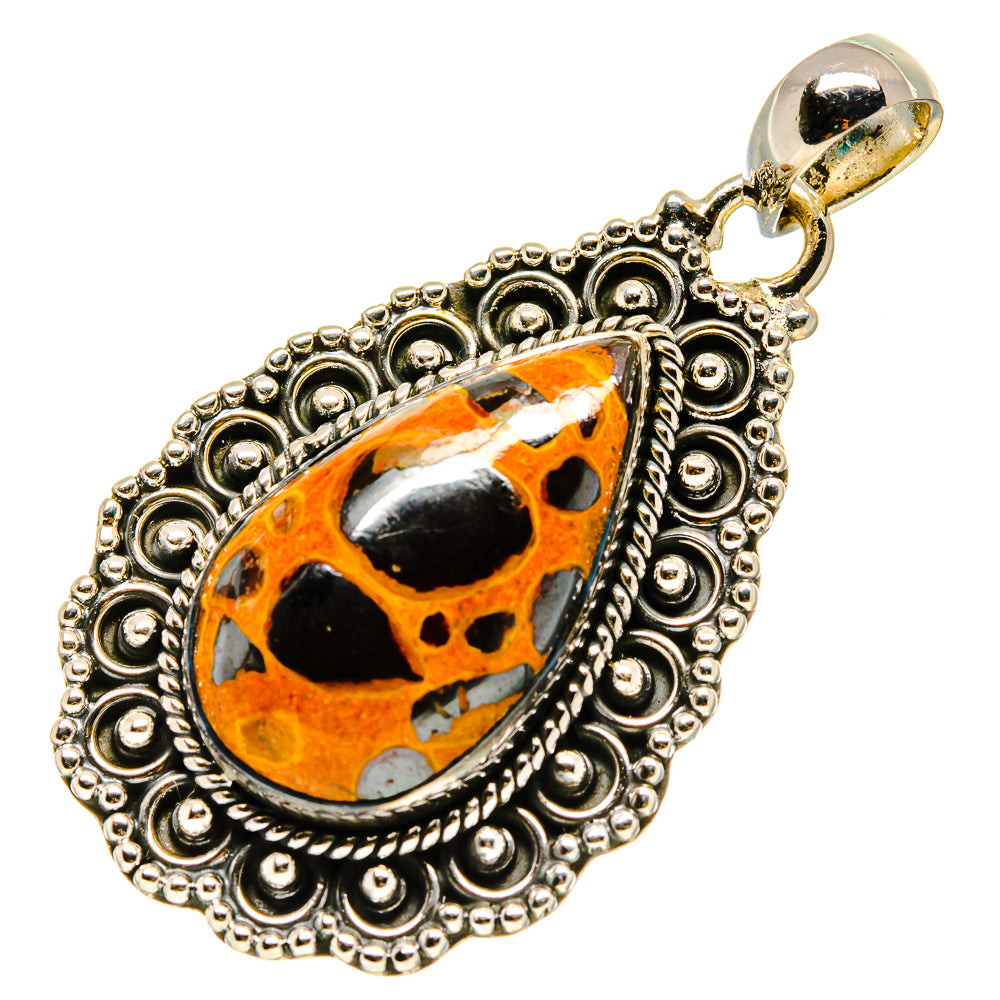 Sterling silver bauxite pendant with orange-black teardrop stone and ornate round filigree