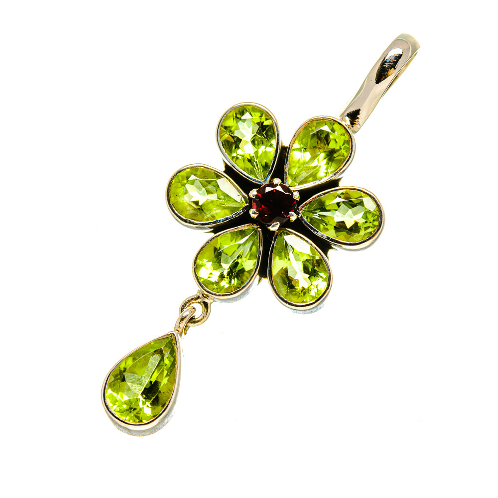 Peridot pendant with sterling silver flower design, green teardrop stones, and dangling drop.