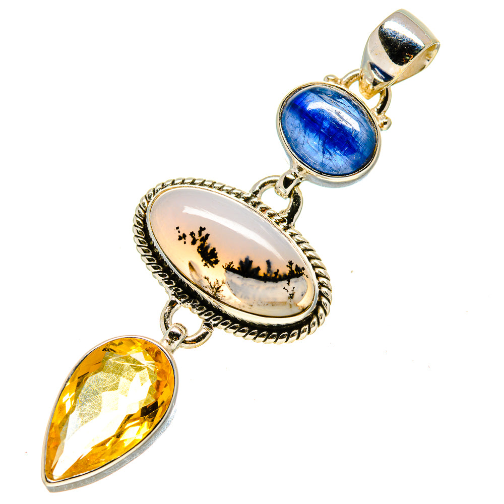 Oval dendrite cabochon with blue round stone and yellow pear drop on silver frame