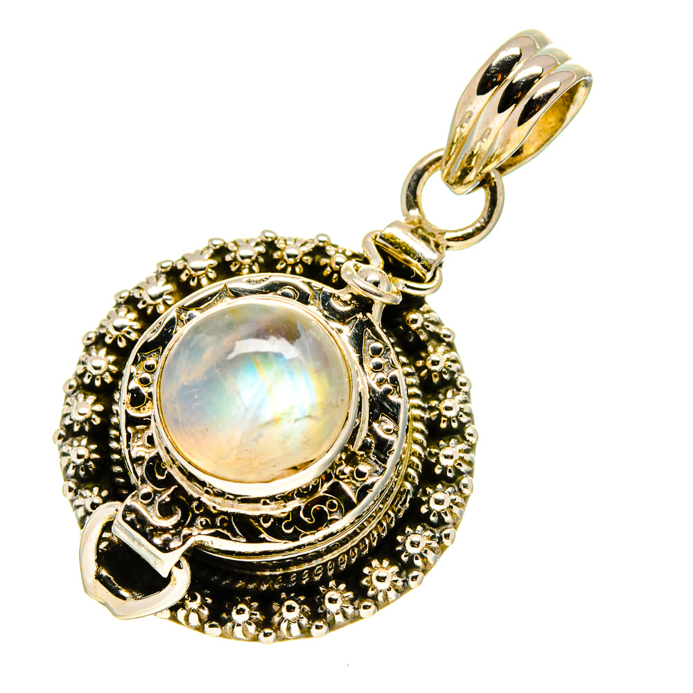 Moonstone pendant with ornate filigree and faceted stone center, metallic hanging bail
