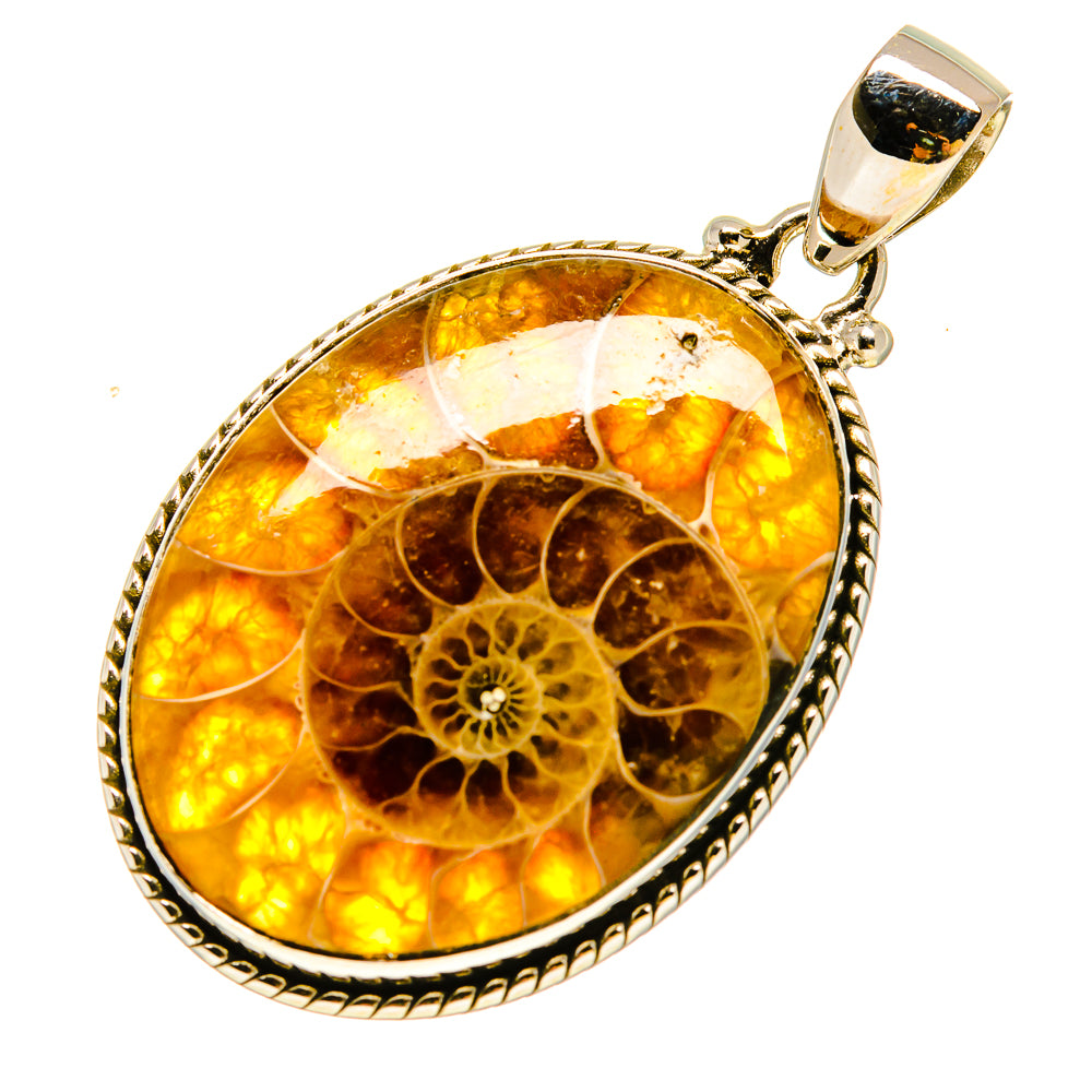 Oval ammonite fossil pendant with textured silver edge, amber-gold gemstone pattern, bail top