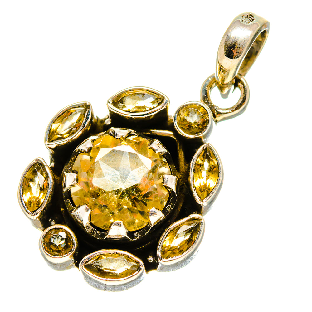 Round faceted citrine pendant with bezel set yellow stones in gold-tone frame