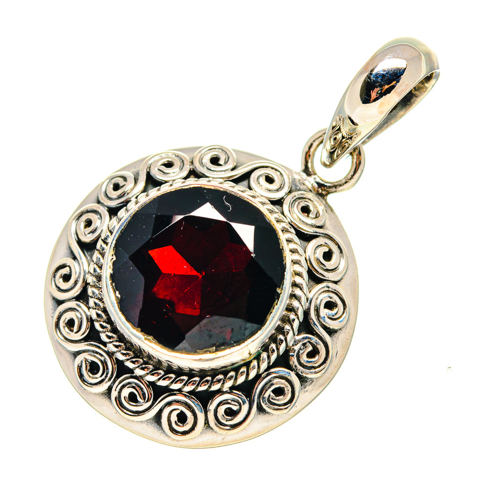 Round sterling silver pendant with red garnet cabochon and ornate filigree bezel