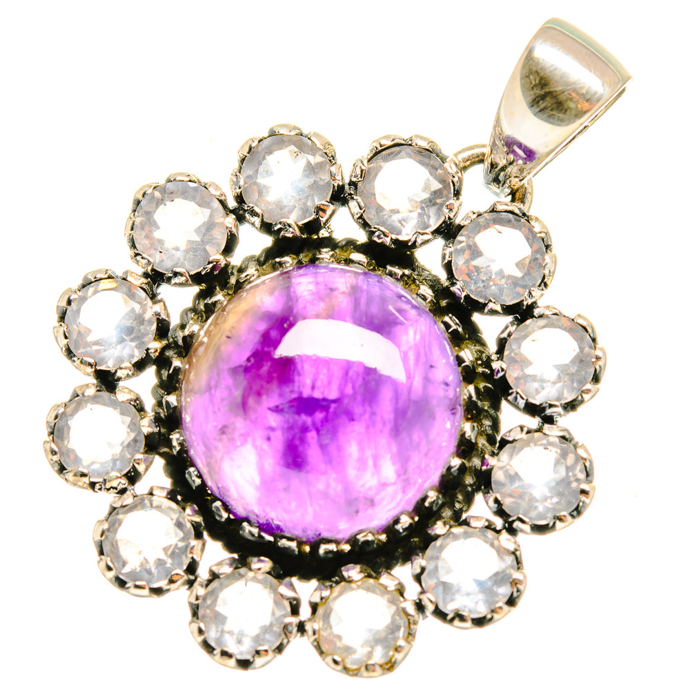 Amethyst pendant with round purple center stone and clear halo gemstones in silver setting