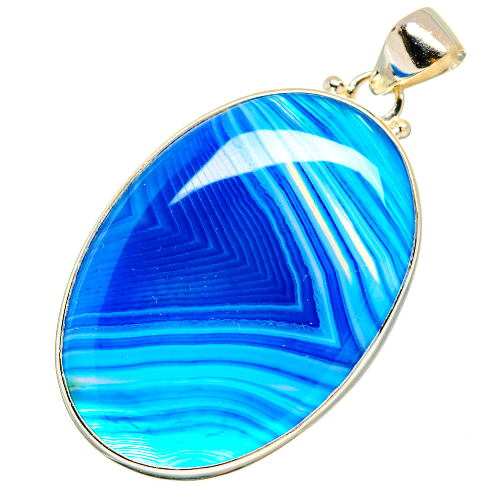 Oval blue agate pendant in sterling silver bezel with top bail