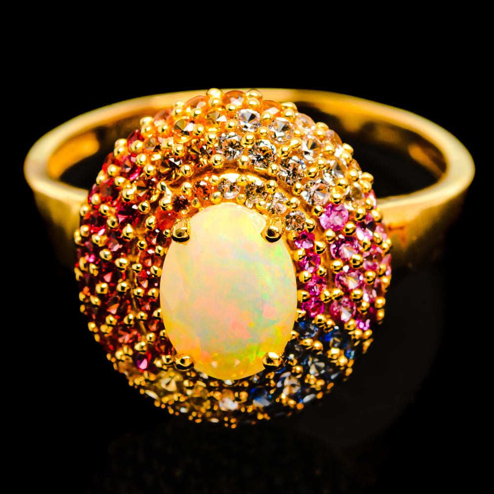 14k yellow gold opal ring with colorful sapphire halo and oval opal center