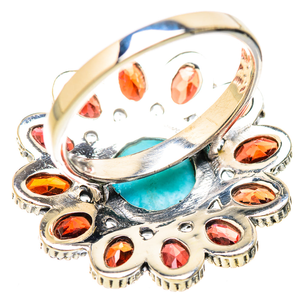 Sterling silver ring with turquoise center and red garnet stones, oval top view
