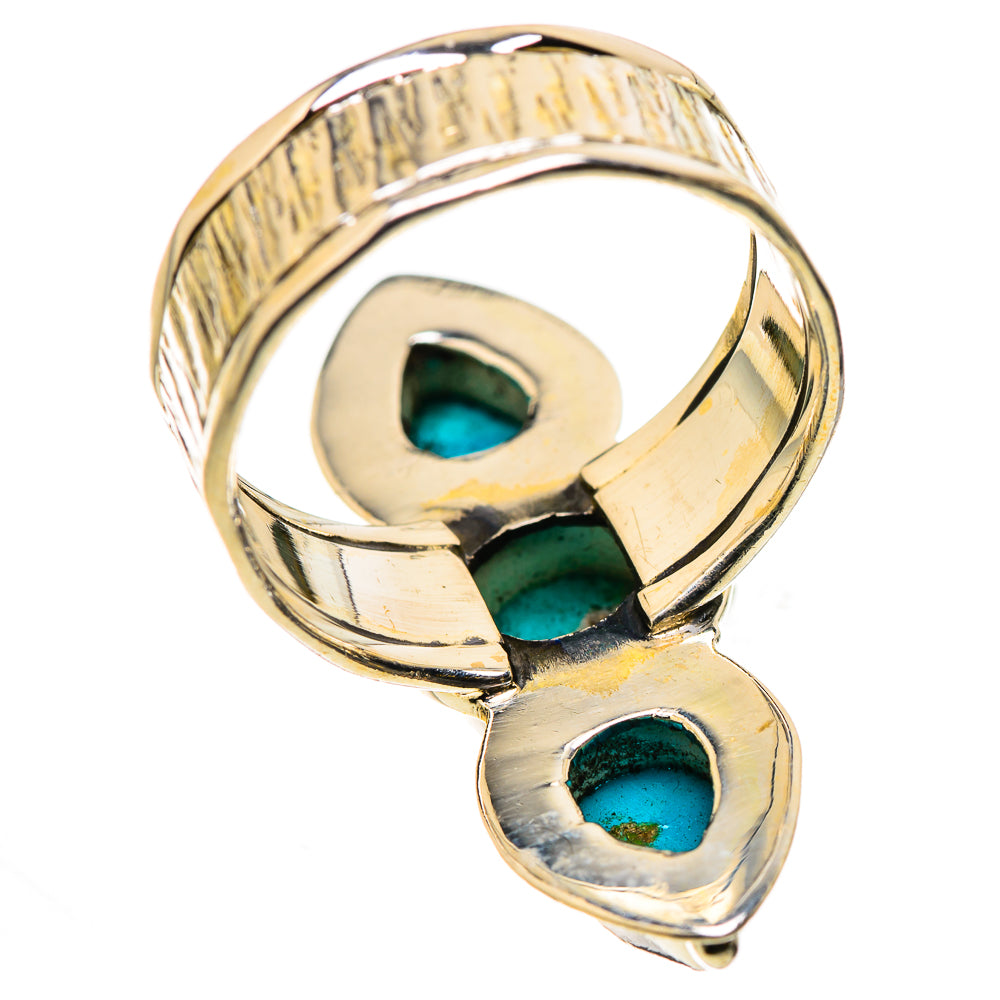 Gold-tone ring band with two bezel-set turquoise stones and open back