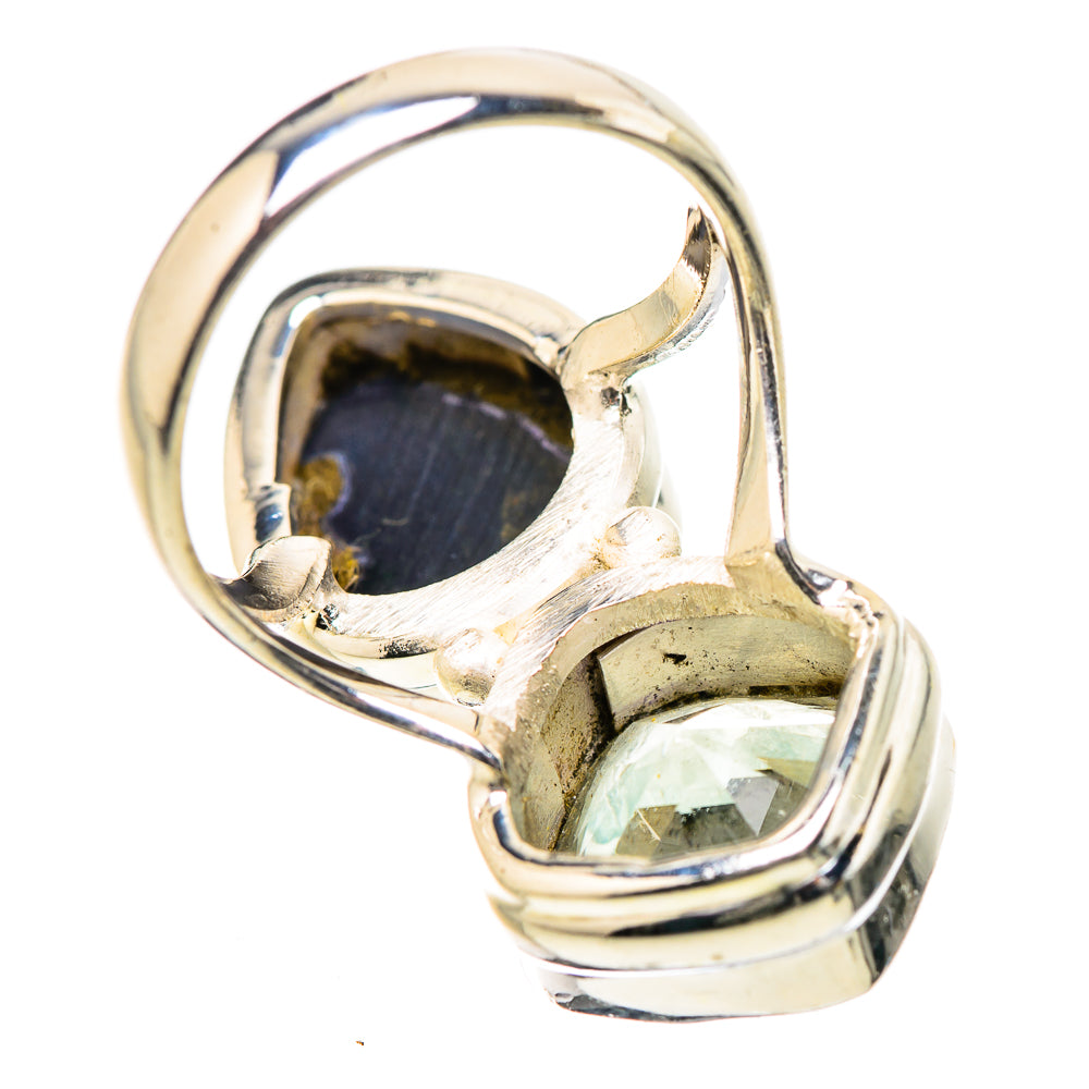 Sterling silver ring showing underside of dark oval and small faceted light gemstone