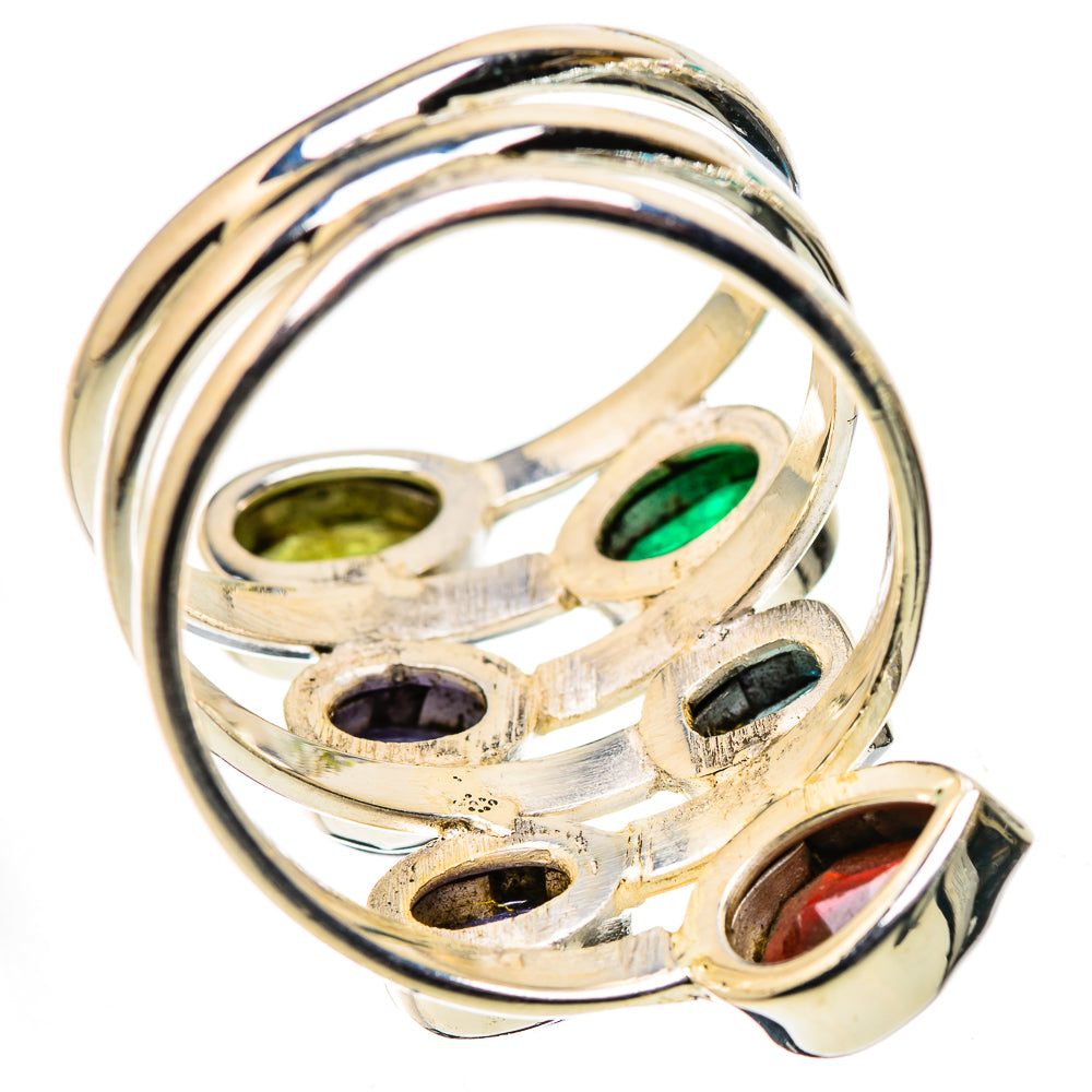 Sterling silver ring underside with green, purple, blue, black, and red stone settings