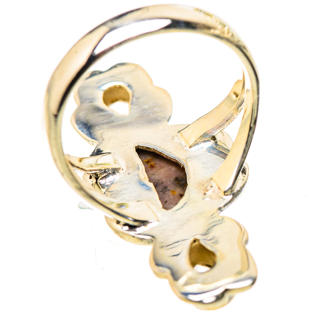 Silver-tone ring with openwork floral setting and gemstone bezel details