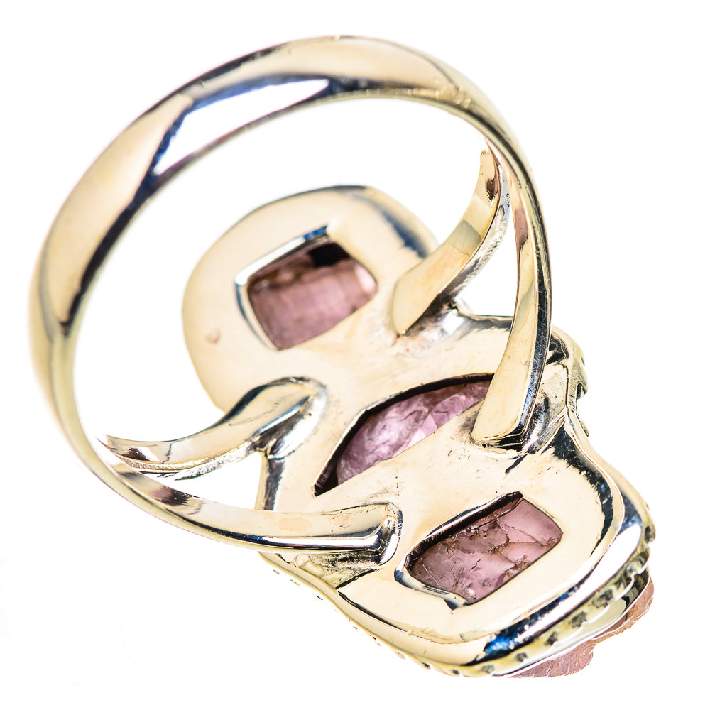 Sterling silver tourmaline ring with openwork band and three small pink stone accents