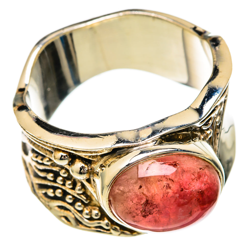 Polished silver-tone ring with oval pink tourmaline cabochon, ornate band with scrollwork