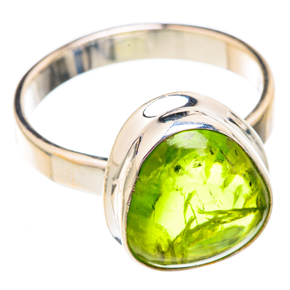 Sterling silver ring with oval green peridot gemstone in a polished bezel setting