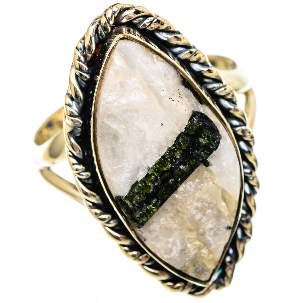 Green tourmaline in clear quartz oval ring with silver twisted rope frame.