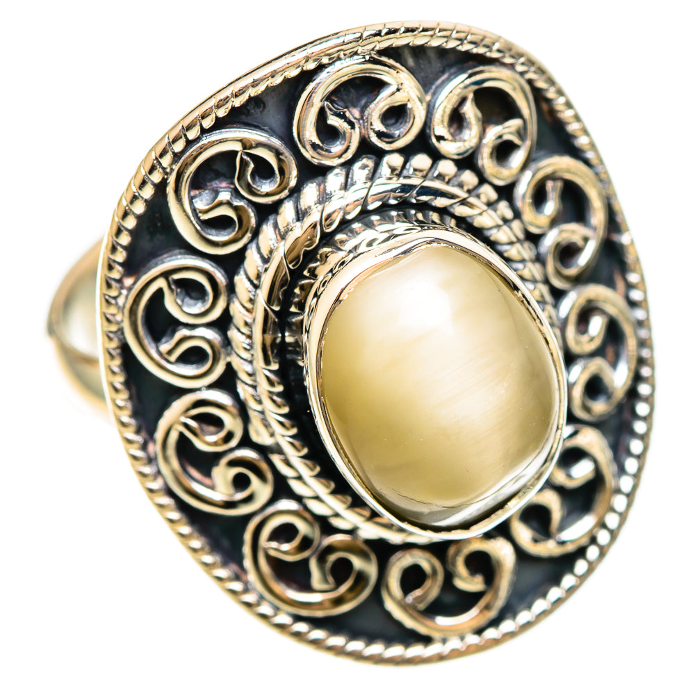 Oval moonstone cabochon ring in sterling silver with dark filigree border