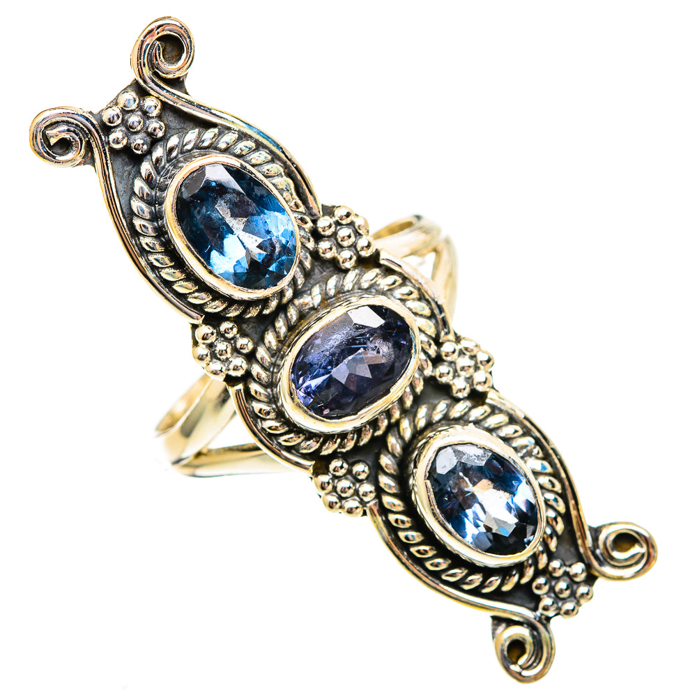Sterling silver ring with three oval faceted blue stones in ornate bezel setting