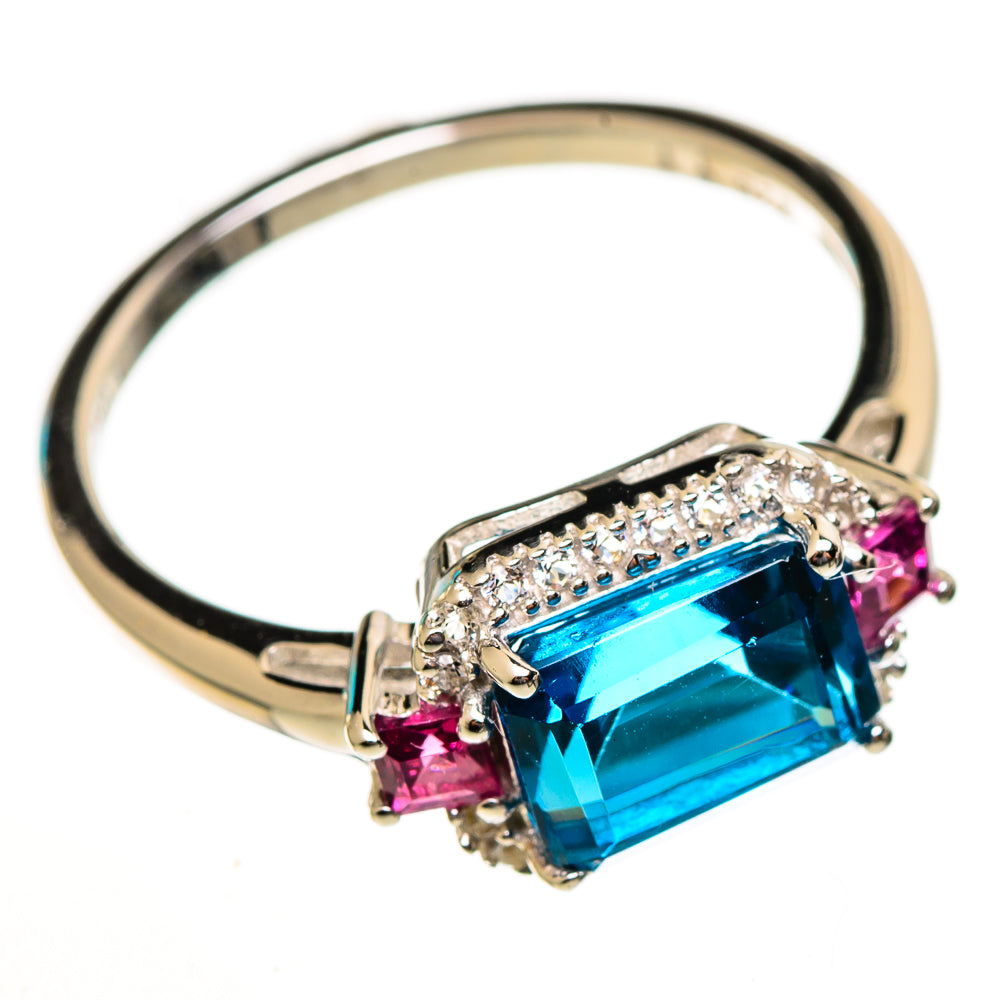 Sterling silver ring with rectangular blue gemstone, pink side stones, and clear halo