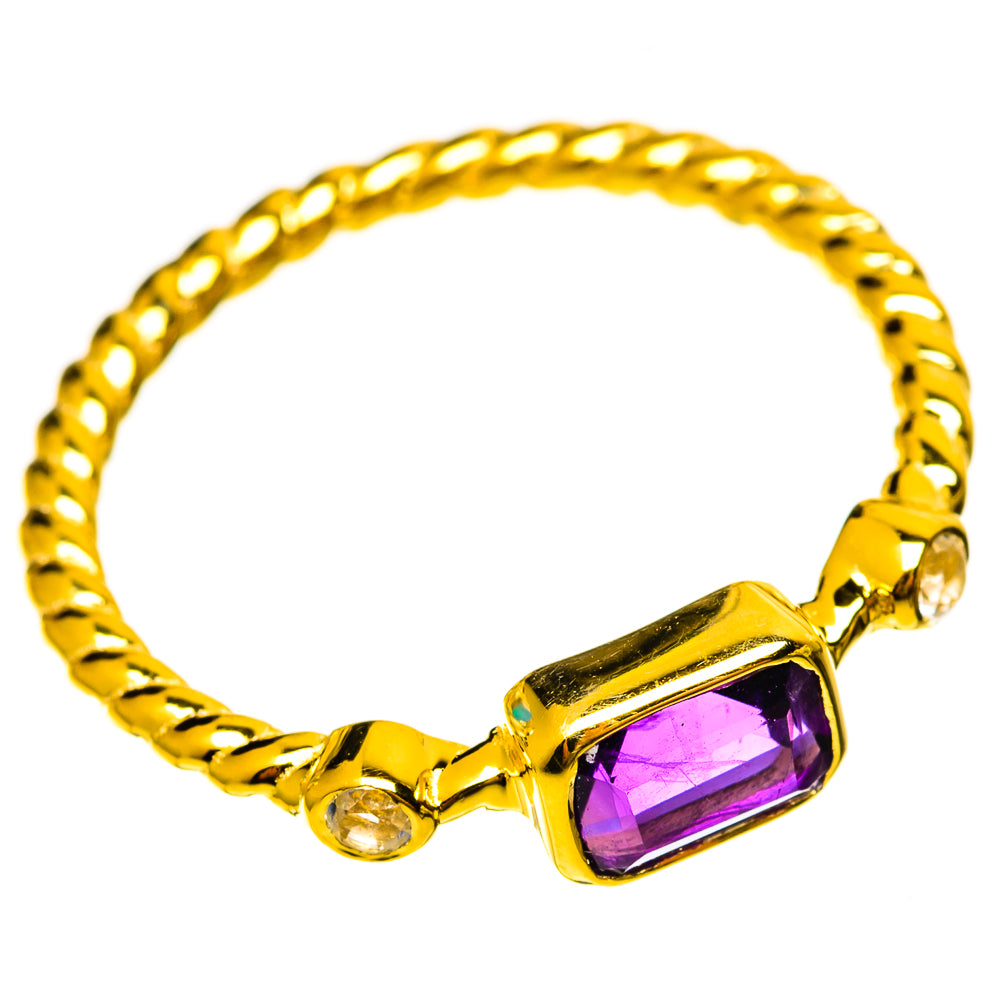 Gold-plated amethyst ring with rope-textured band, purple rectangular center, clear accent