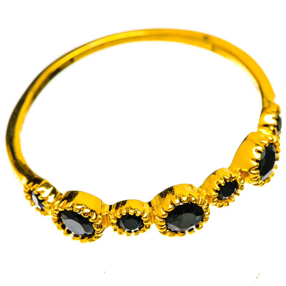 Gold-plated black onyx ring with three oval stones, gold beaded bezel